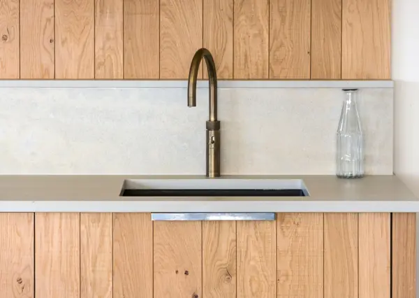 Precision raw band-sawn oak cladding where every board aligns seamlessly, grain running through in perfect succession - a testament to the skill of our makers and the foresight of our designers.